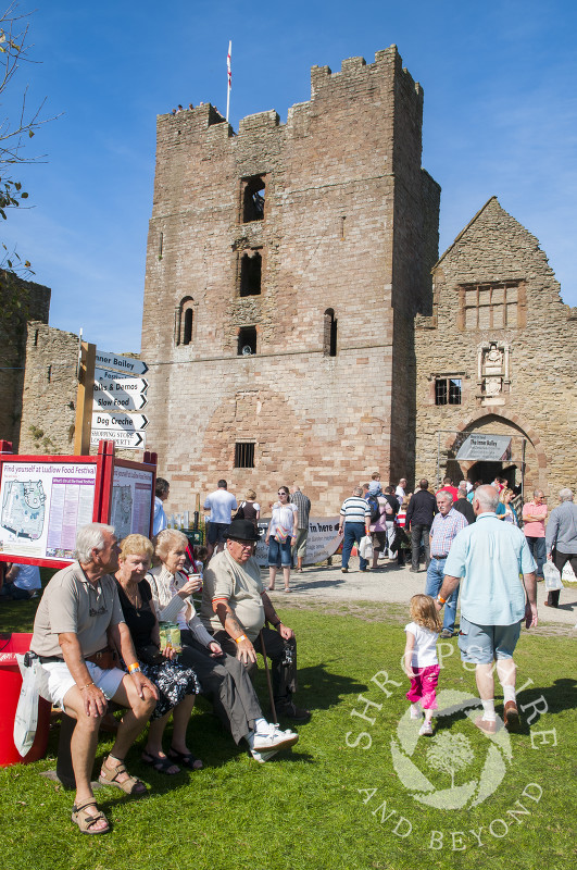 Taking a break in the castle grounds during Ludlow Food Festival, Shropshire, England.