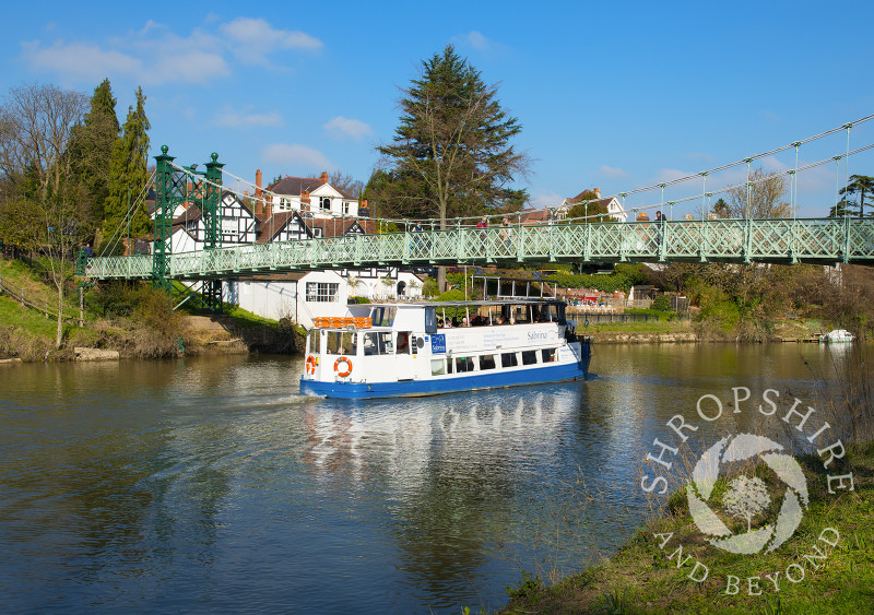 Sabrina pleasure boat makes its way under Porthill Bridge on the River Severn at Shrewsbury, Shropshire, England.