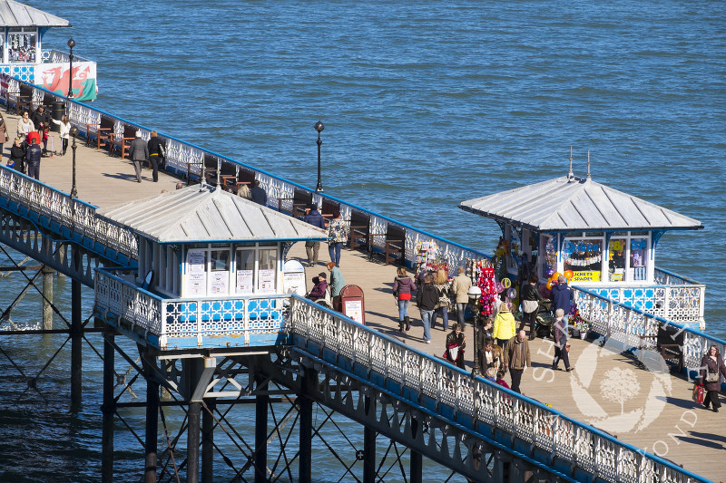 Visitors throng the pier at Llandudno, north Wales.