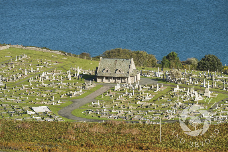 The Church of St Tudno with its churchyard and the adjacent town cemetery on the Great Orme, Llandudno, Wales.