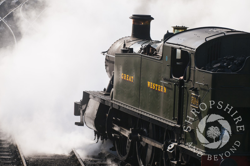 A GWR 5164 Large Prairie steam locomotive pulls into Hampton Loade Station, Severn Valley Railway, Shropshire, England.