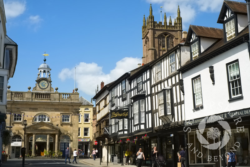 Looking up Broad Street to the Buttercross and St Laurence's Church, Ludlow, Shropshire, England.
