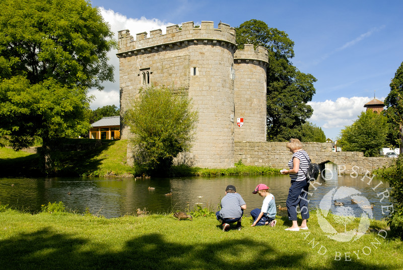 Feeding the ducks at Whittington Castle near Oswestry, Shropshire, England.