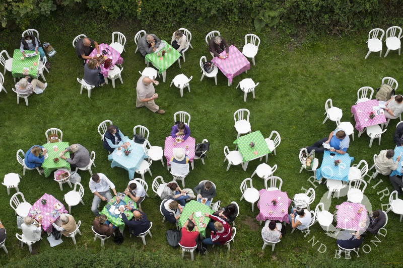 Visitors take a break in the castle grounds at the 2014 Ludlow Food Festival, Shropshire, England.