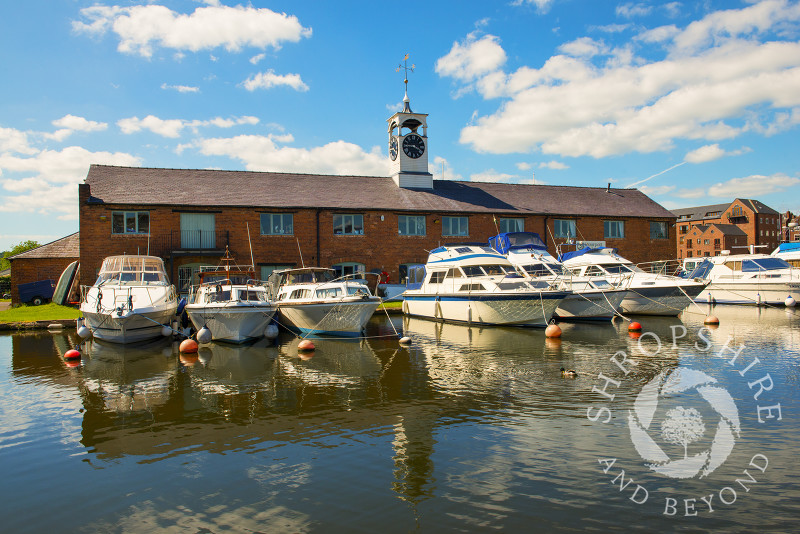 A line of boats moored in front of Stourport Yacht Club at Stourport-on-Severn, Worcestershire, England.
