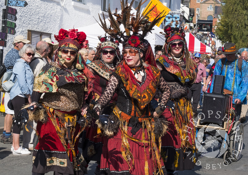 The Urban Gypsies dance their way through Bishop's Castle at the Michaelmas Fair, Shropshire.