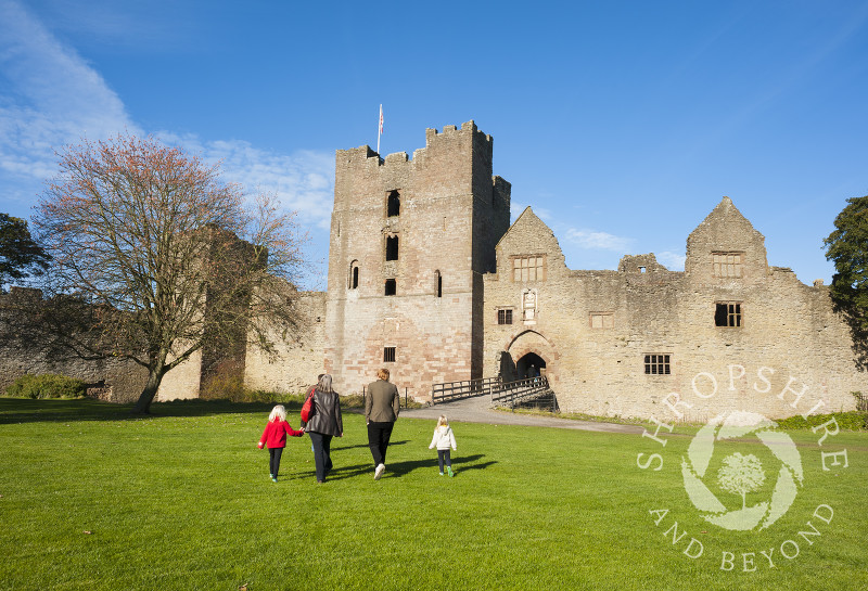 Visitors stroll through the Outer Bailey at Ludlow Castle, Shropshire, England.