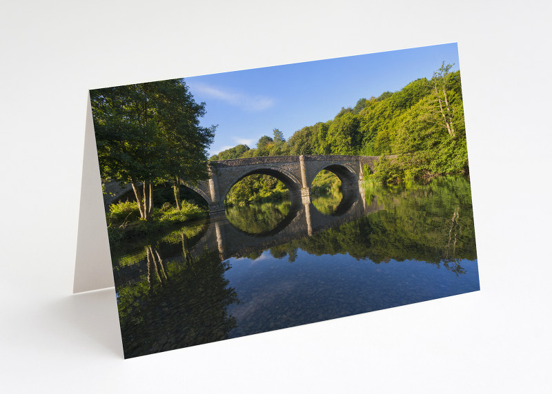 Dinham Bridge reflected in the River Teme, Ludlow, Shropshire.