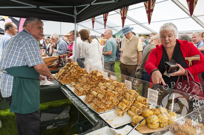 A customer makes her selection from a stall at Ludlow Food Festival, Shropshire, England.