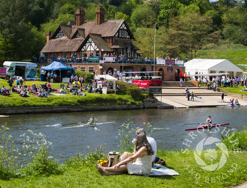 Spectators enjoy the spring sunshine at Shrewsbury Regatta on the River Severn, Shropshire.