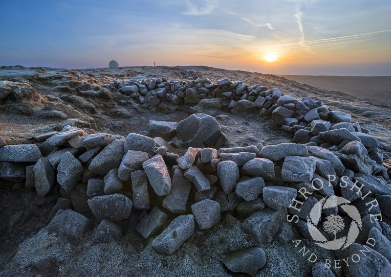 Frost-covered rocks on Titterstone Clee at sunrise.